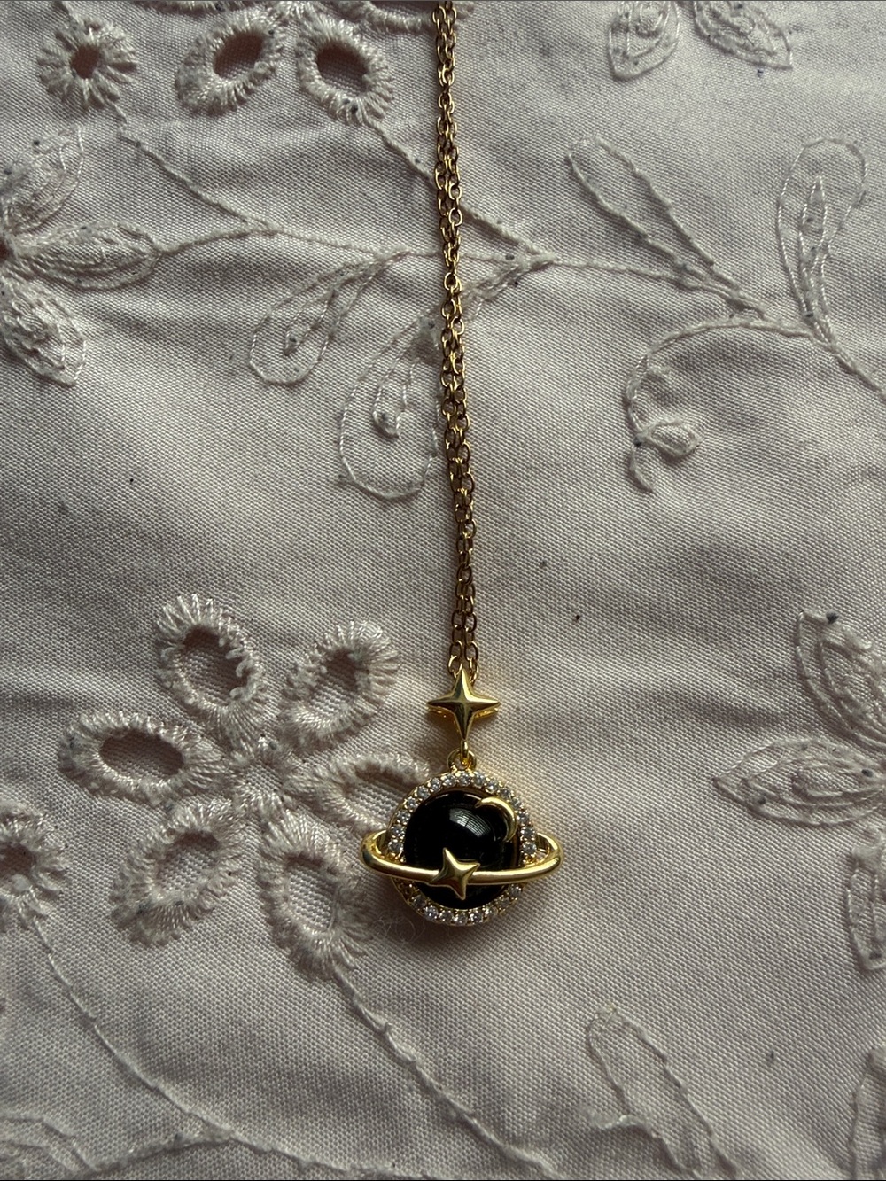 Gold-Tone Black Planet Pendant Necklace with Star Accents
